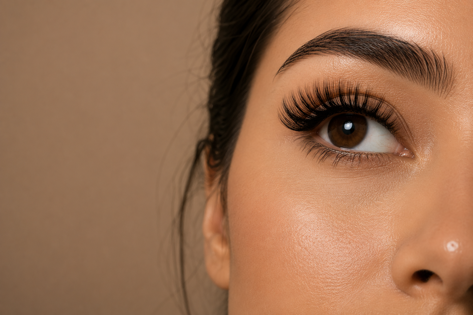 Macro photograph of dense, airy 5D silk eyelash extensions.